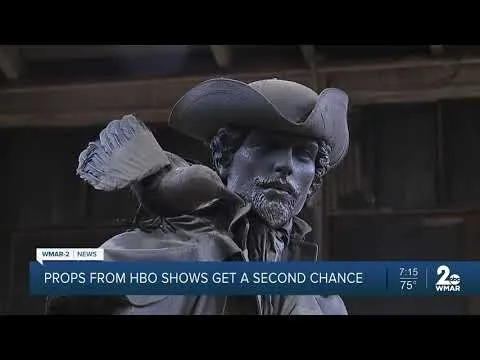 Salvaged HBO prop of a man in a tricorn hat with a bird on his shoulder, a unique secondhand find at Baltimore non-profit Second Chance, Inc. perfect for home decor or film sets.